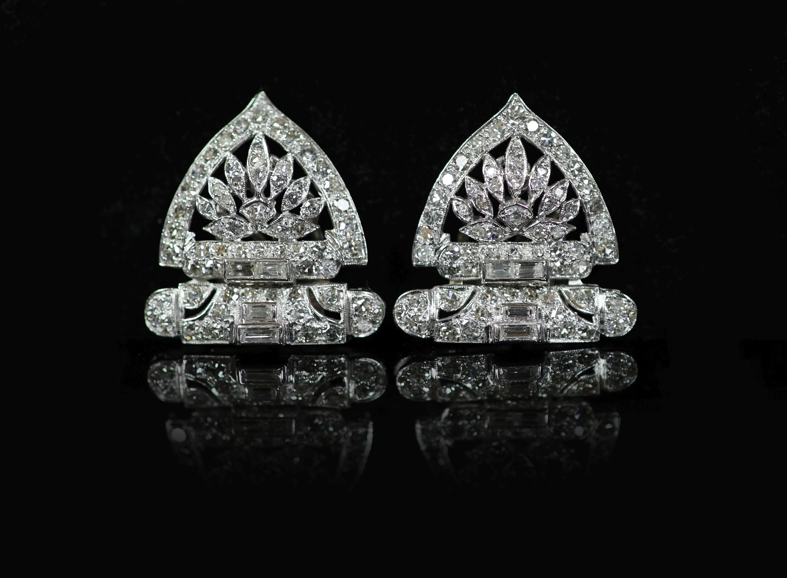 A pair of 1960's pierced platinum and diamond fan shaped ear clips
